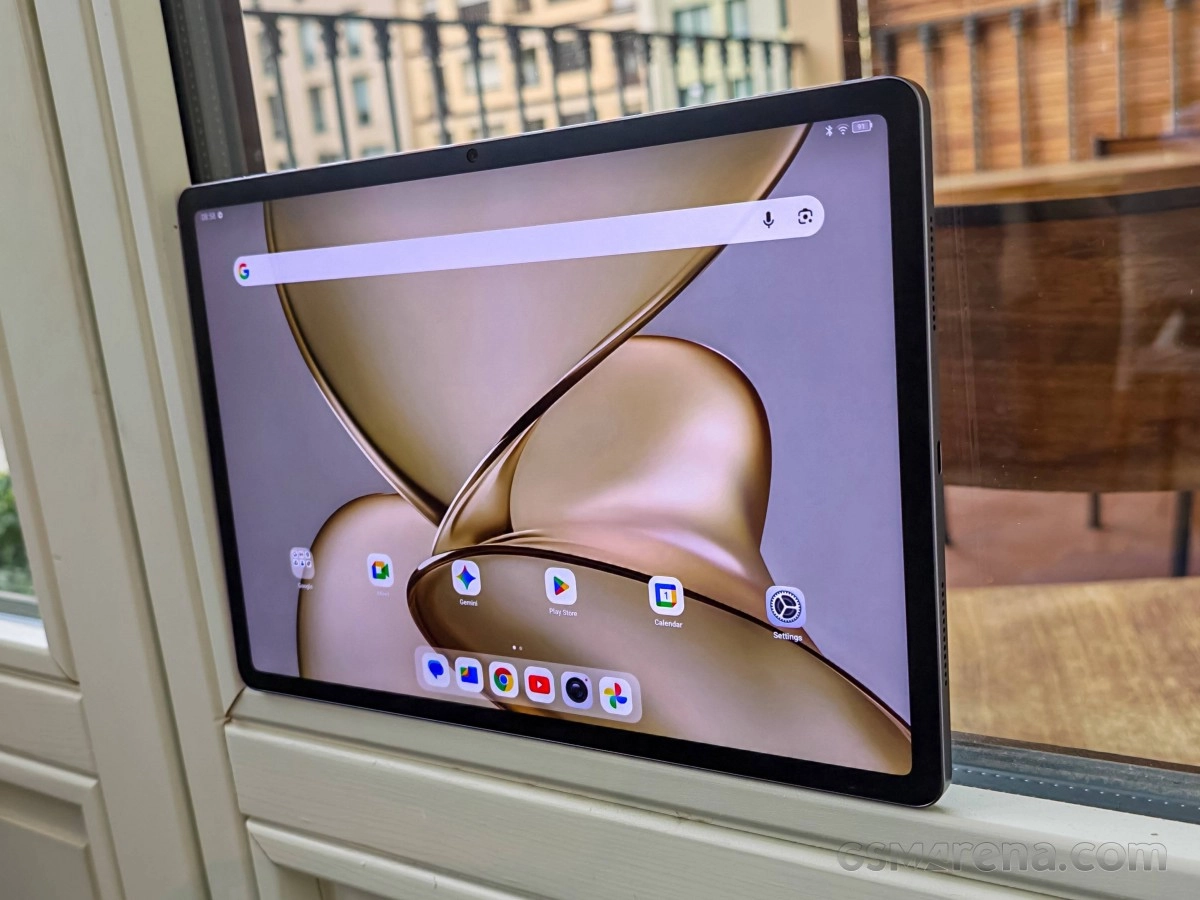 TCL NxtPaper tablet displaying Android home screen.