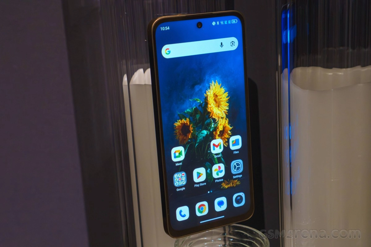 TCL NxtPaper 70 Pro phone screen with sunflower wallpaper.