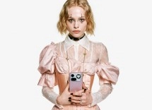 Woman holding light pink smartphone