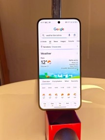 TCL NxtPaper AMOLED phone showing weather app.