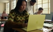 MacBook Neo with students in classroom