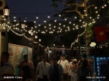 Phu Quoc night market street lit by string lights.