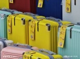 Colorful luggage displayed at Phu Quoc island market.