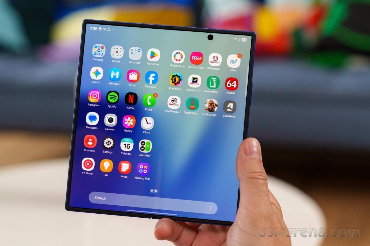 Samsung Galaxy Z Fold shows app icons on screen.