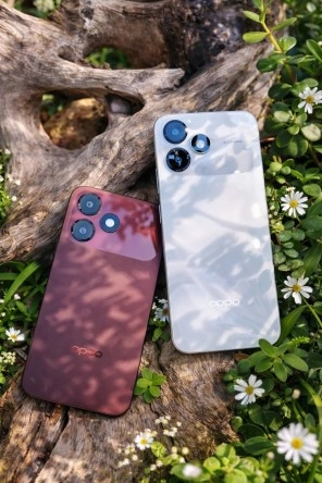 Two Oppo A6c smartphones, maroon and white.