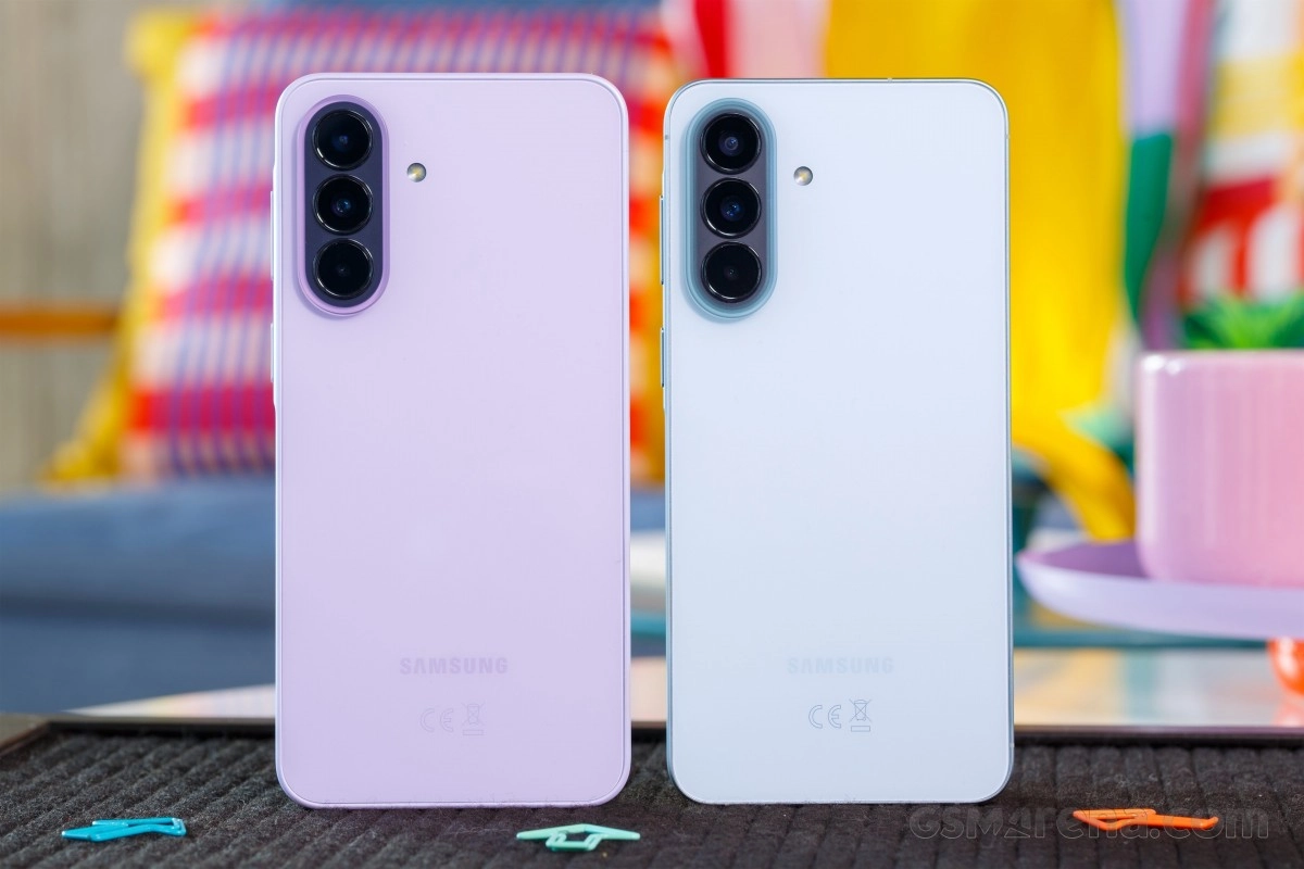Two Samsung phones, purple and white.