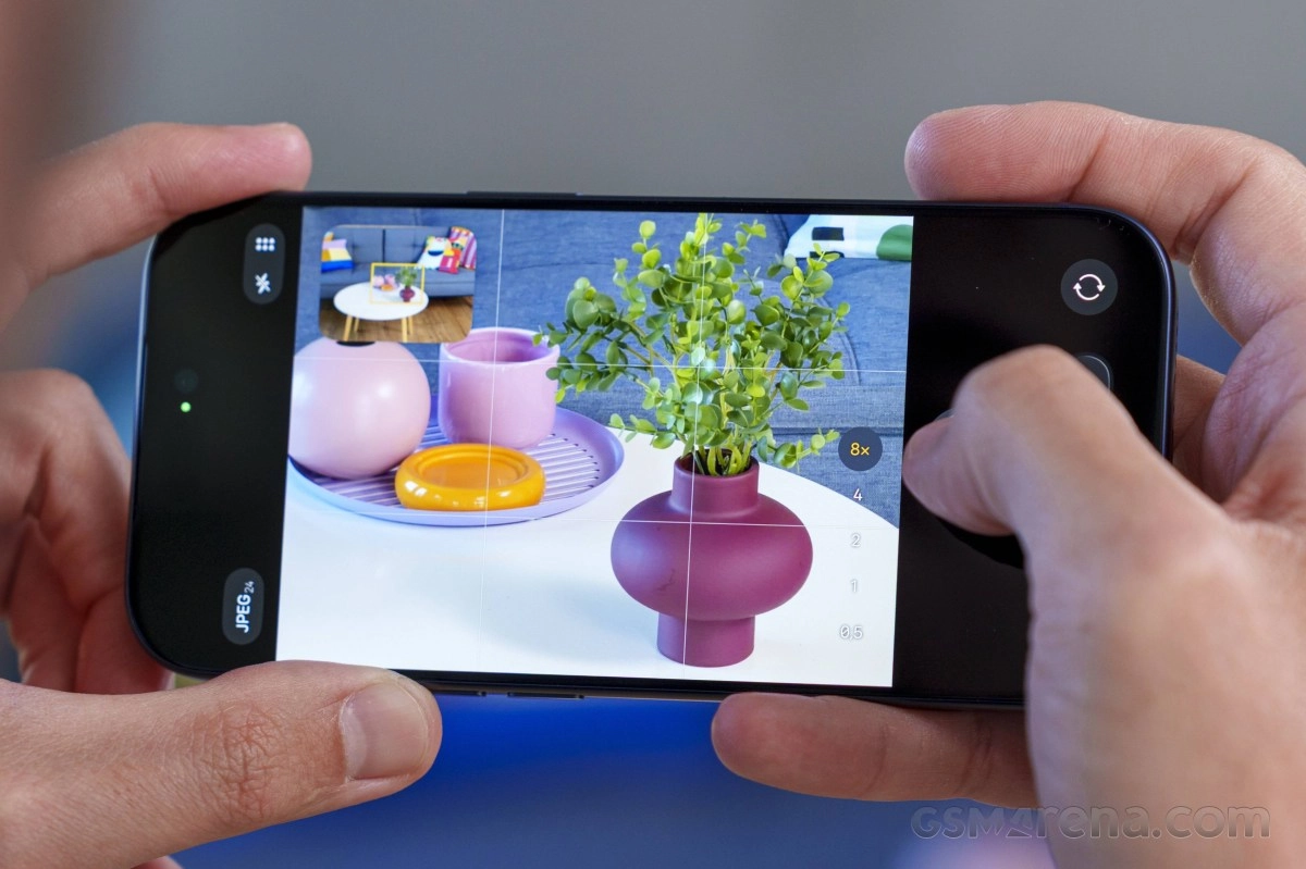 iPhone camera UI shows 8x zoom on vase.