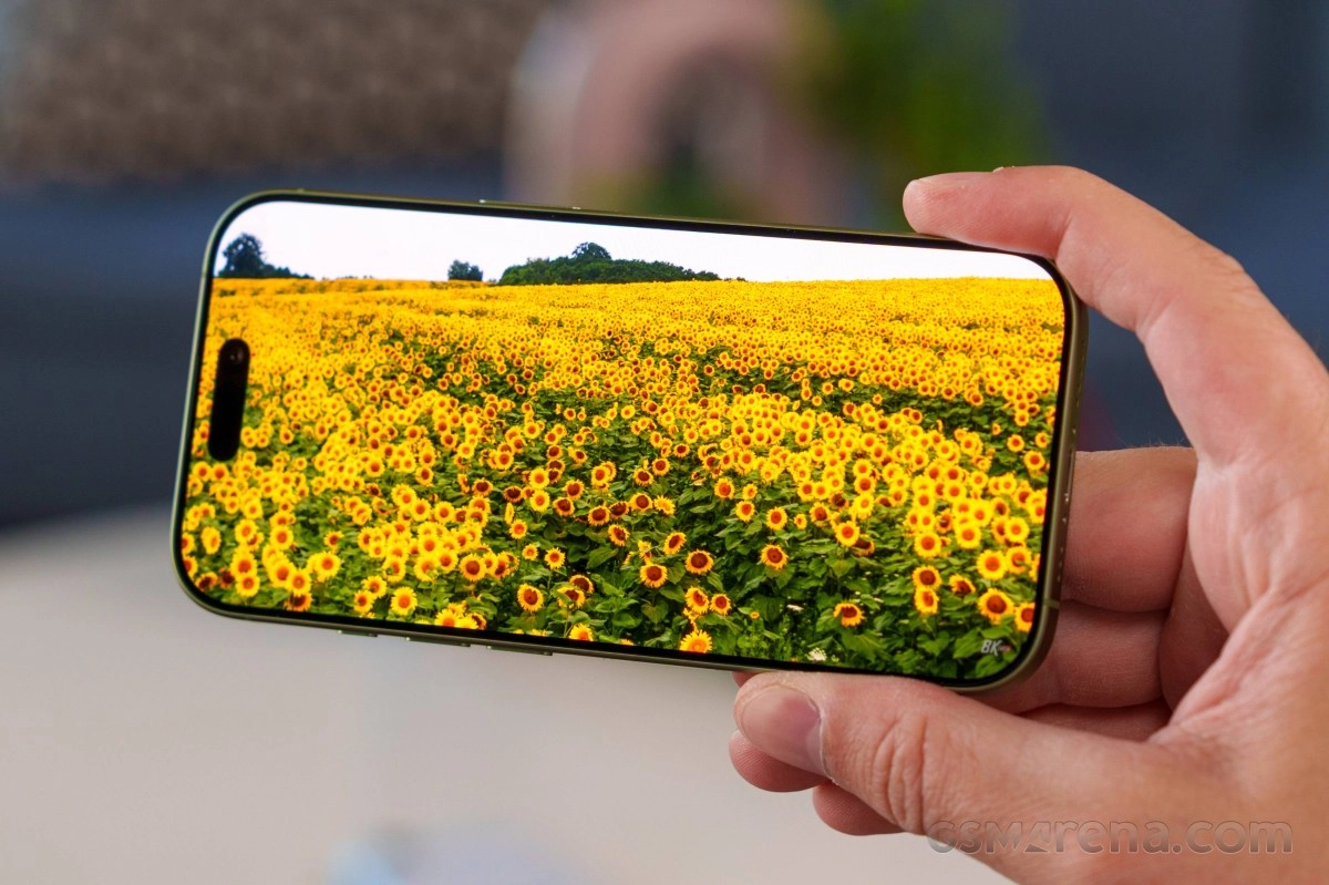 iPhone 18 showing field of sunflowers on screen