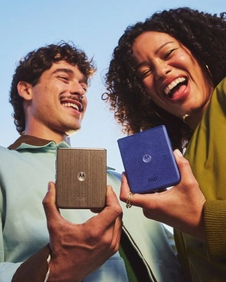 Motorola Razr 70 phones held by smiling couple