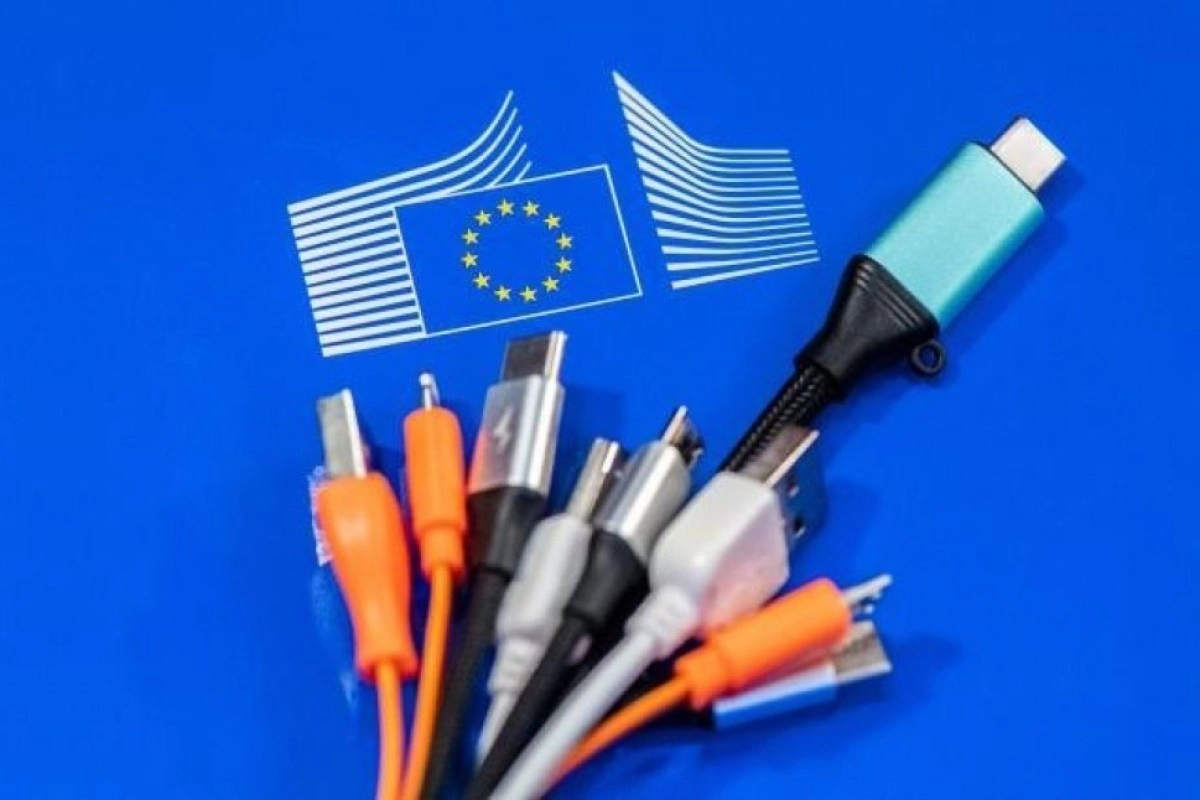 EU flag and various charging cables on blue.