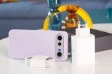 vivo X300 FE phone with charger, lens, cable.