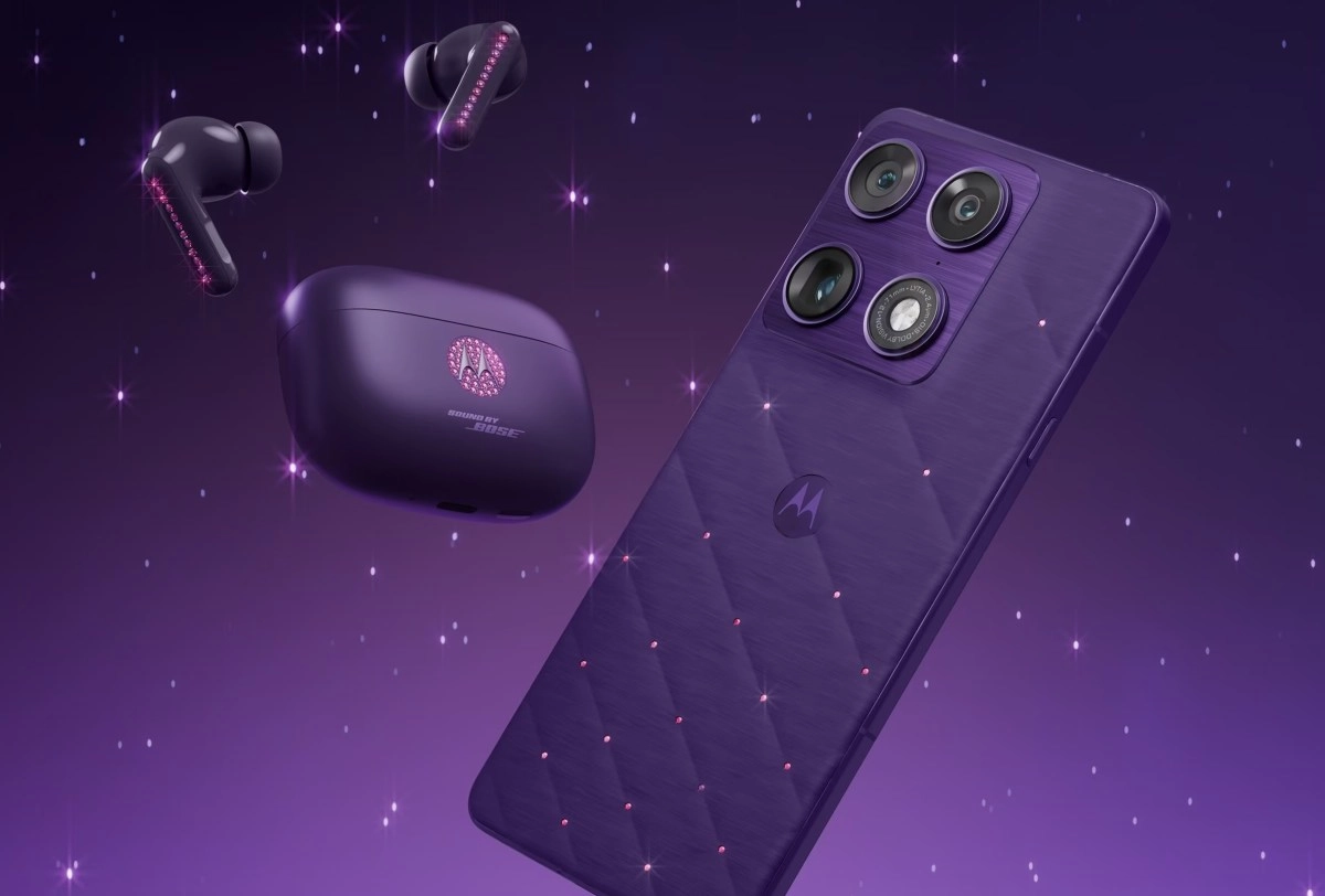 Purple Motorola phone and earbuds with Swarovski crystals.