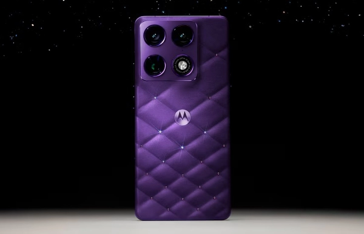 Purple Motorola phone with quilted back and crystals.