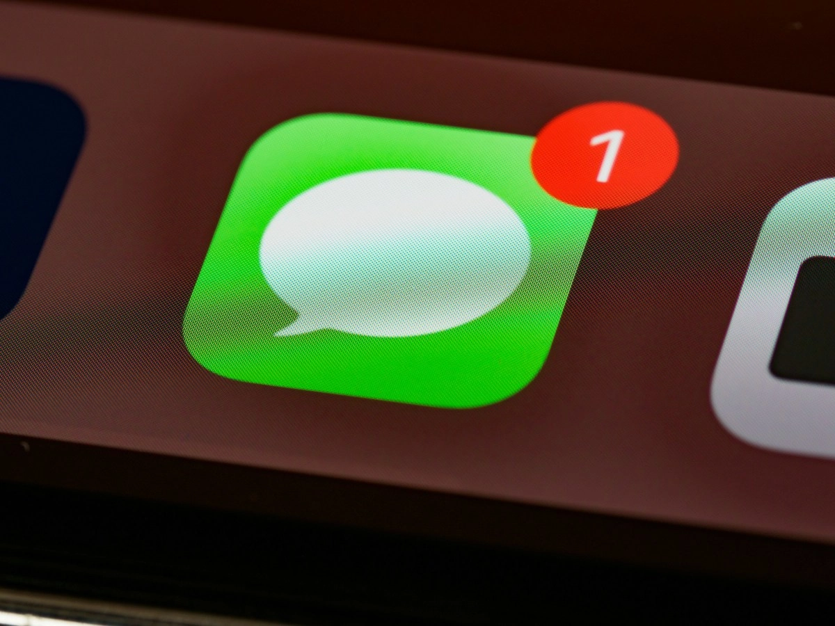 iPhone Messages app icon with notification badge.