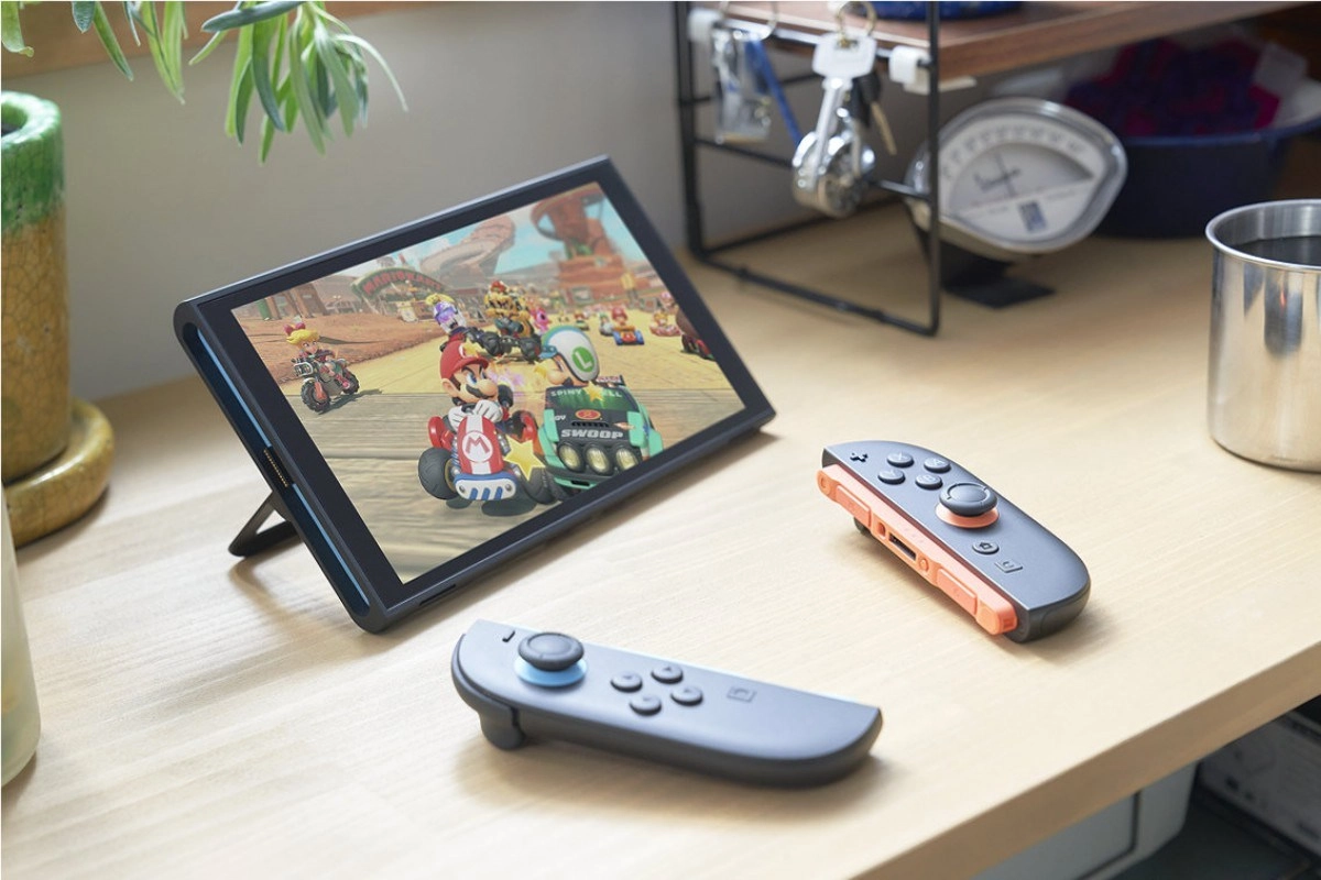 Nintendo Switch playing Mario Kart with detached controllers.