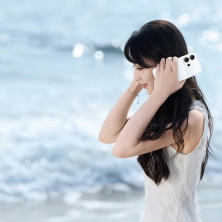 Woman teases new vivo S60 phone on beach.