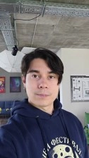 Man in hoodie takes selfie video, Samsung Galaxy A37.