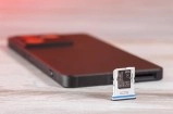Sony Xperia 1 VIII SIM tray beside phone