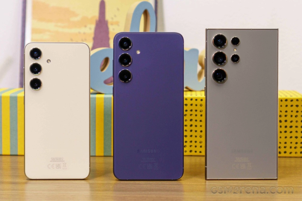 Three Samsung Galaxy S24 phones in different colors.
