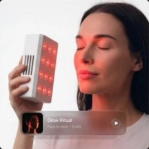 Ultrahuman Photon red light therapy device on face.