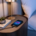Motorola Edge (2026) charging on bedside table.