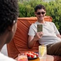 Man holds Motorola Edge (2026) phone outdoors