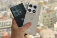 Two Motorola Razr Fold phones held.