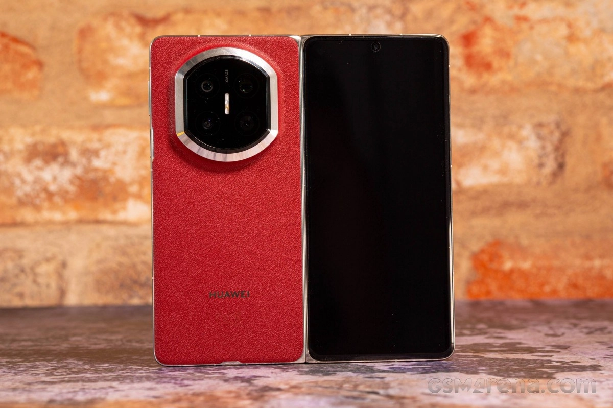 Red Huawei phone with circular camera module.