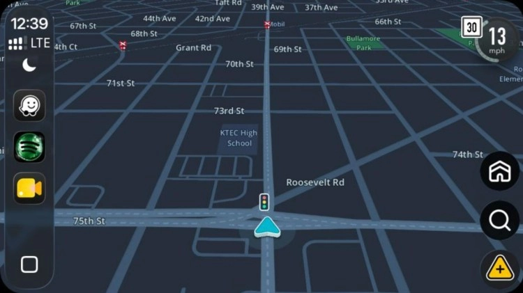 Waze app displays traffic light feature on map.