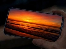 Sharp Aquos R11 with sunset image displayed.