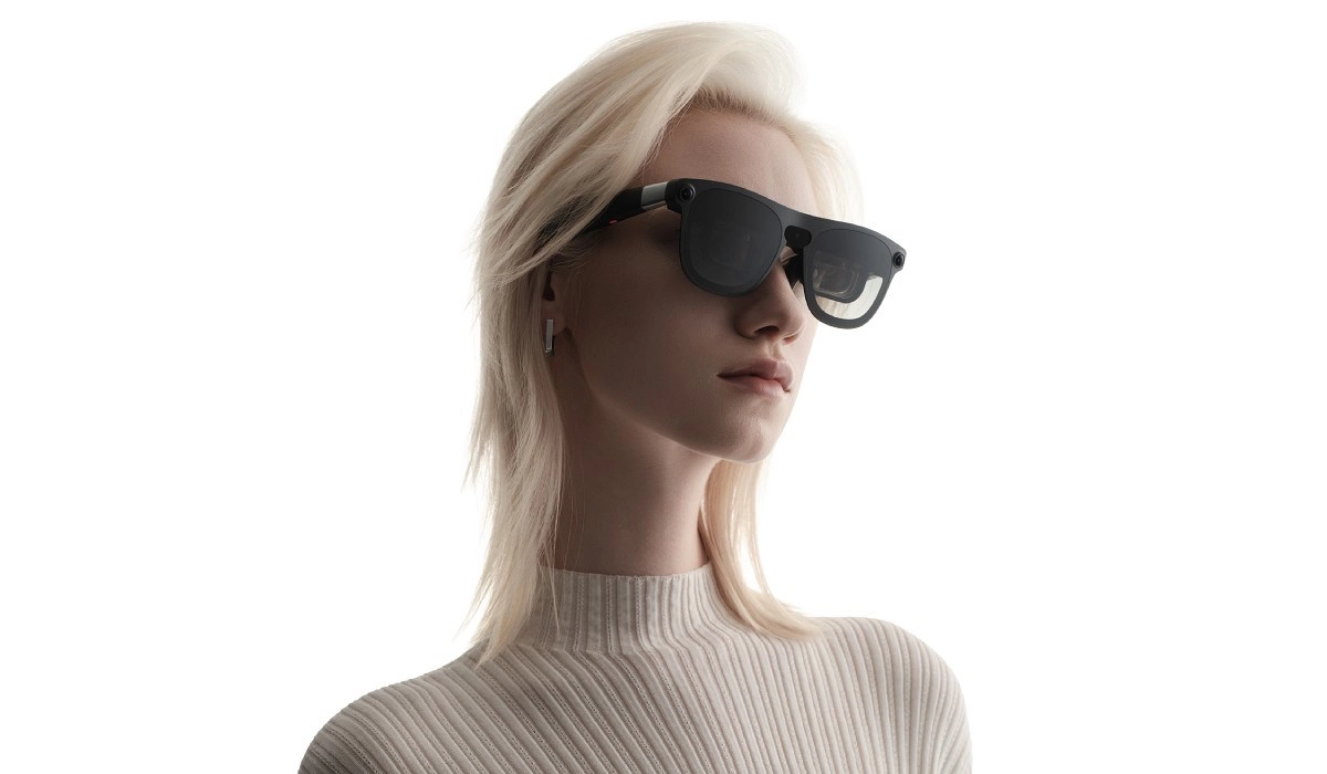 Xreal Aura glasses worn by woman.