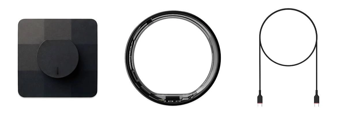 Ultrahuman Ring Air smart ring with charging accessories.