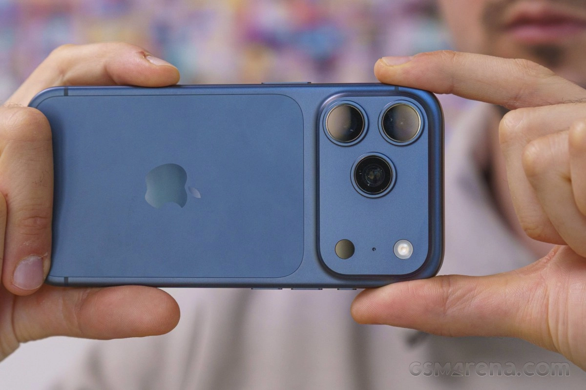 Blue iPhone with triple camera module.