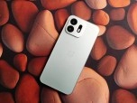OnePlus N6 phone on patterned background.