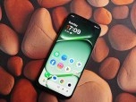 OnePlus N6 smartphone with apps on screen.