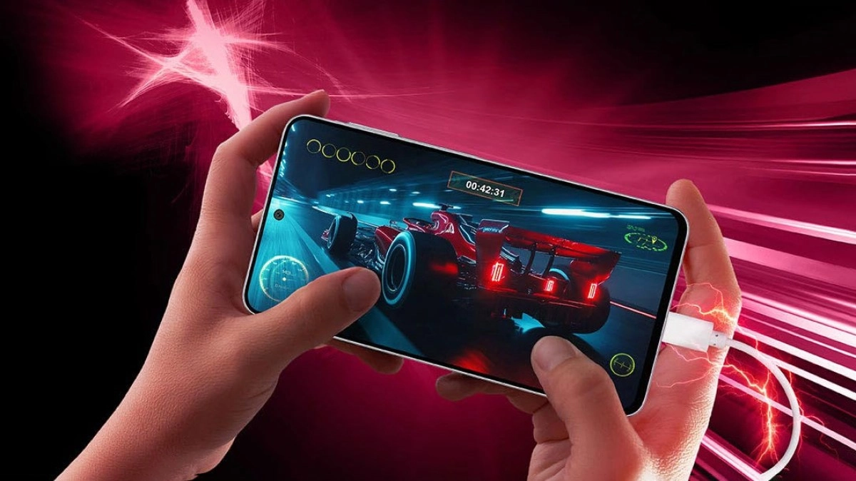 Hands playing racing game on Samsung Galaxy M47.