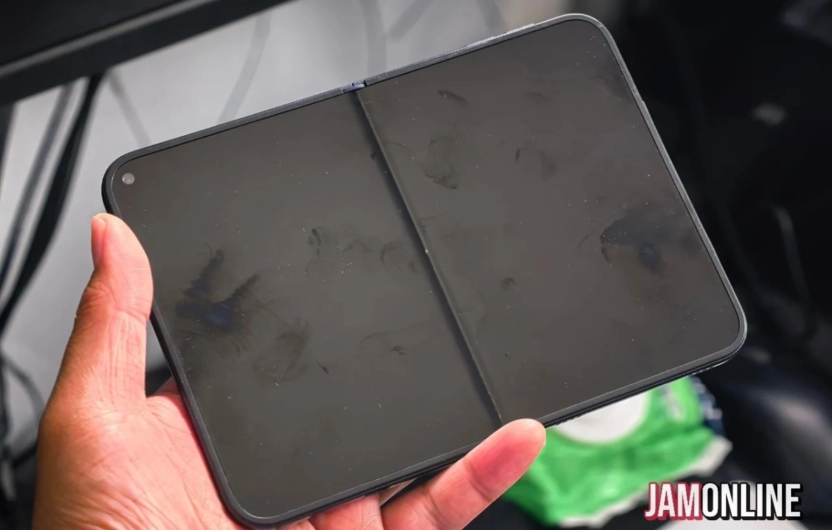 Black foldable iPhone Ultra dummy held in hand.