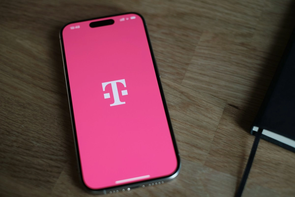 T-Mobile phone with bright pink screen.