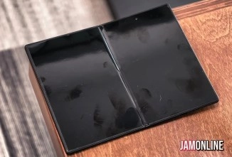 Black Galaxy Z Fold 8 dummy unit on wooden surface.