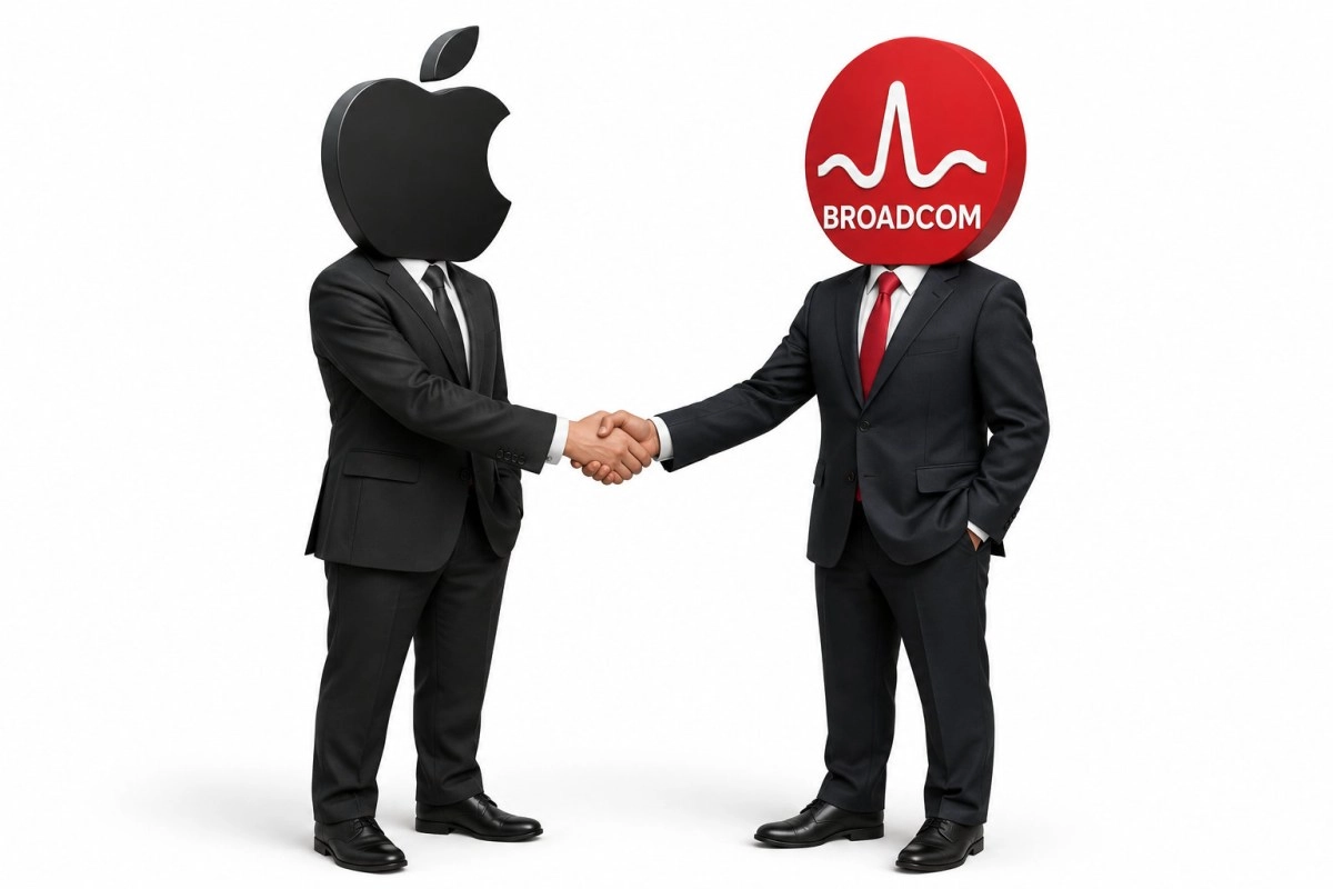 Apple and Broadcom executives shake hands.