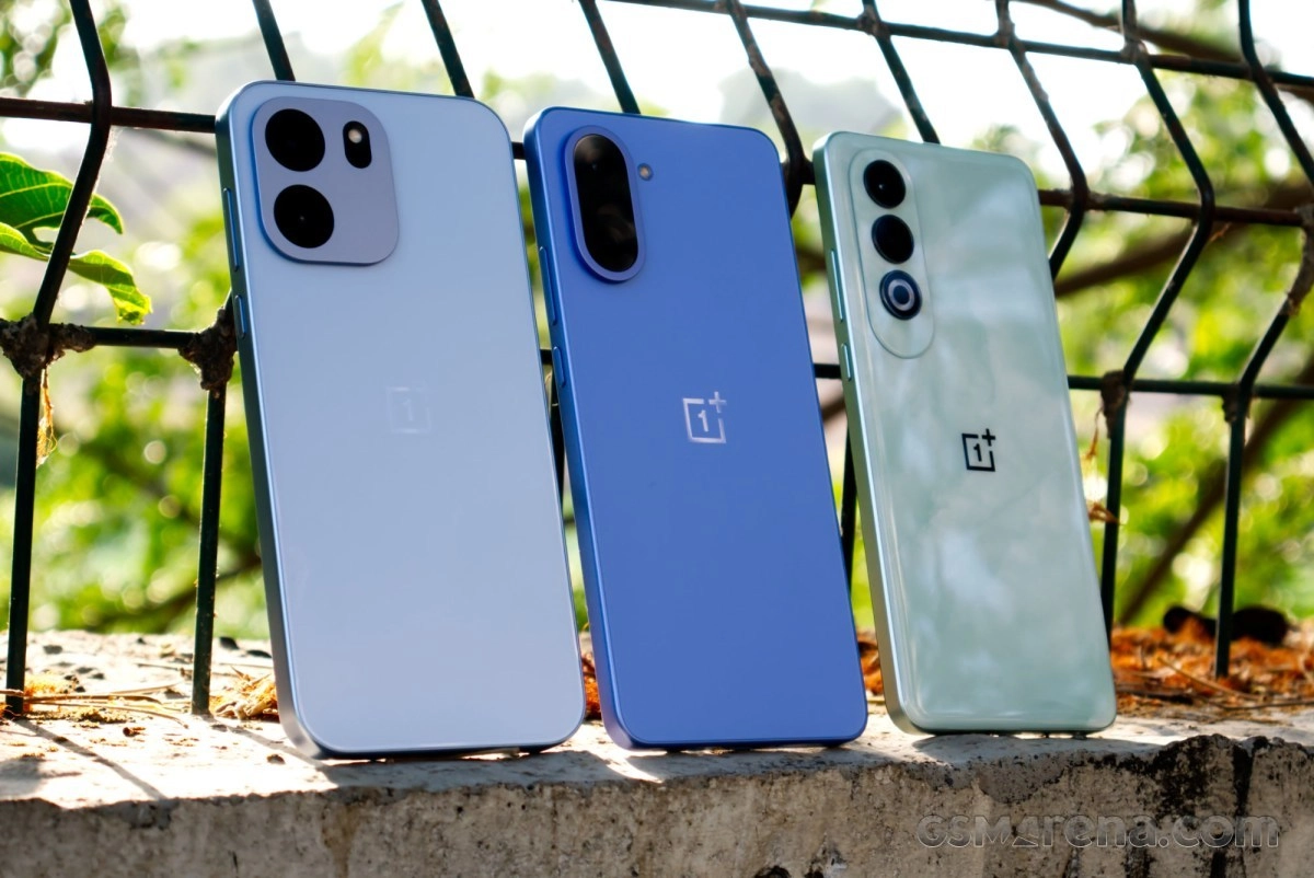 Three OnePlus phones in different colors.