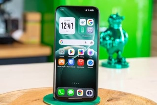 Tecno Camon 50 Ultra front view on wooden stand.