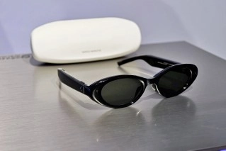 Black Samsung Gentle Monster smart glasses and white case.