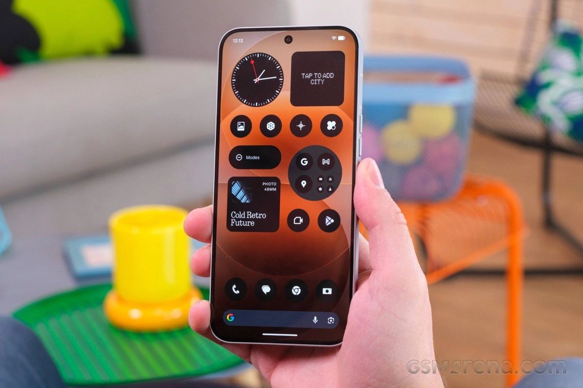 Nothing phone with clock widget and app icons.