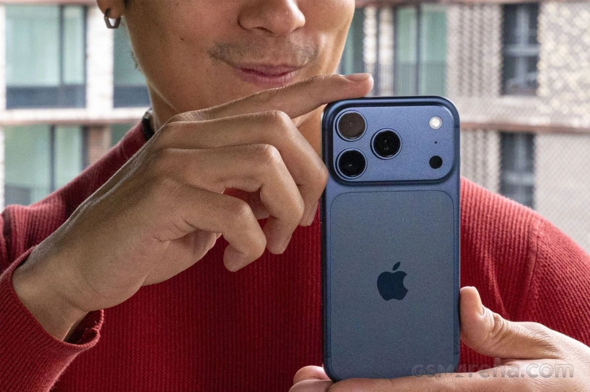 iPhone 13 Pro blue phone held by person