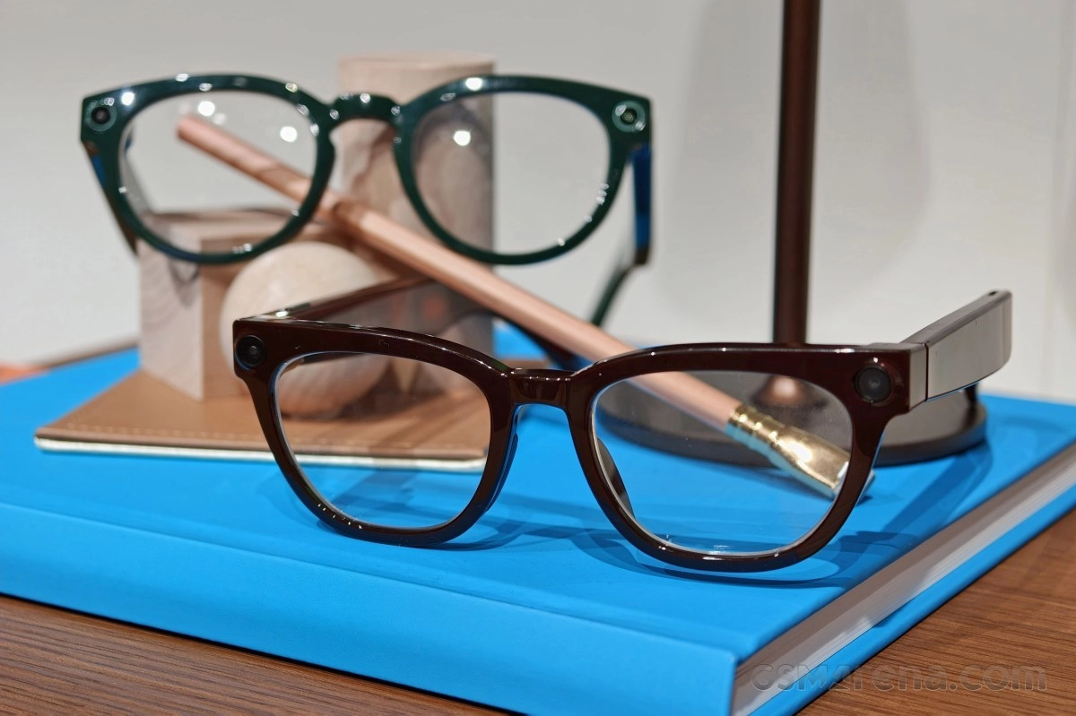 Two pairs of smart glasses with cameras.