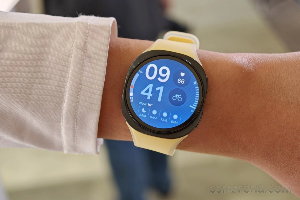 Samsung smartwatch with blue watch face and yellow band.