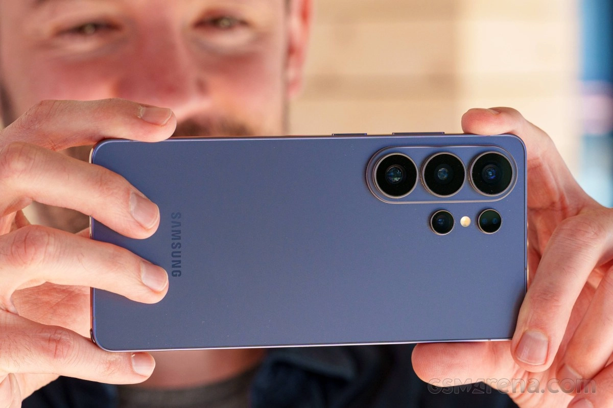 Purple Samsung phone with multiple camera lenses.