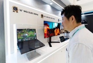 Man views Samsung 16" WQ OLED 300Hz display.