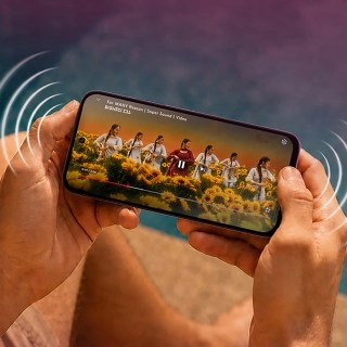 Tecno Spark Go 3 Pro playing video outdoors.